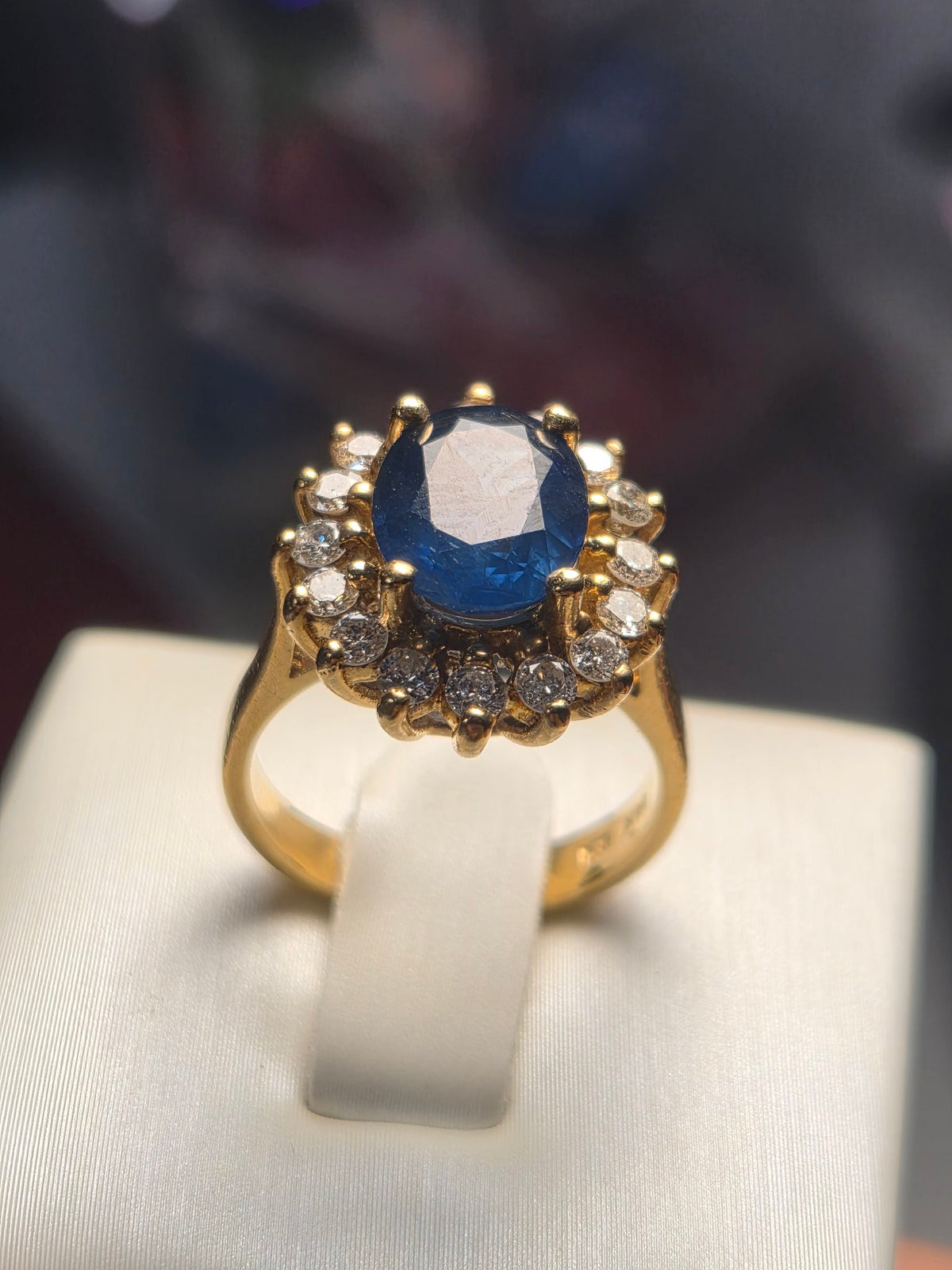 Sapphire and Diamond Halo Ring in Yellow Gold