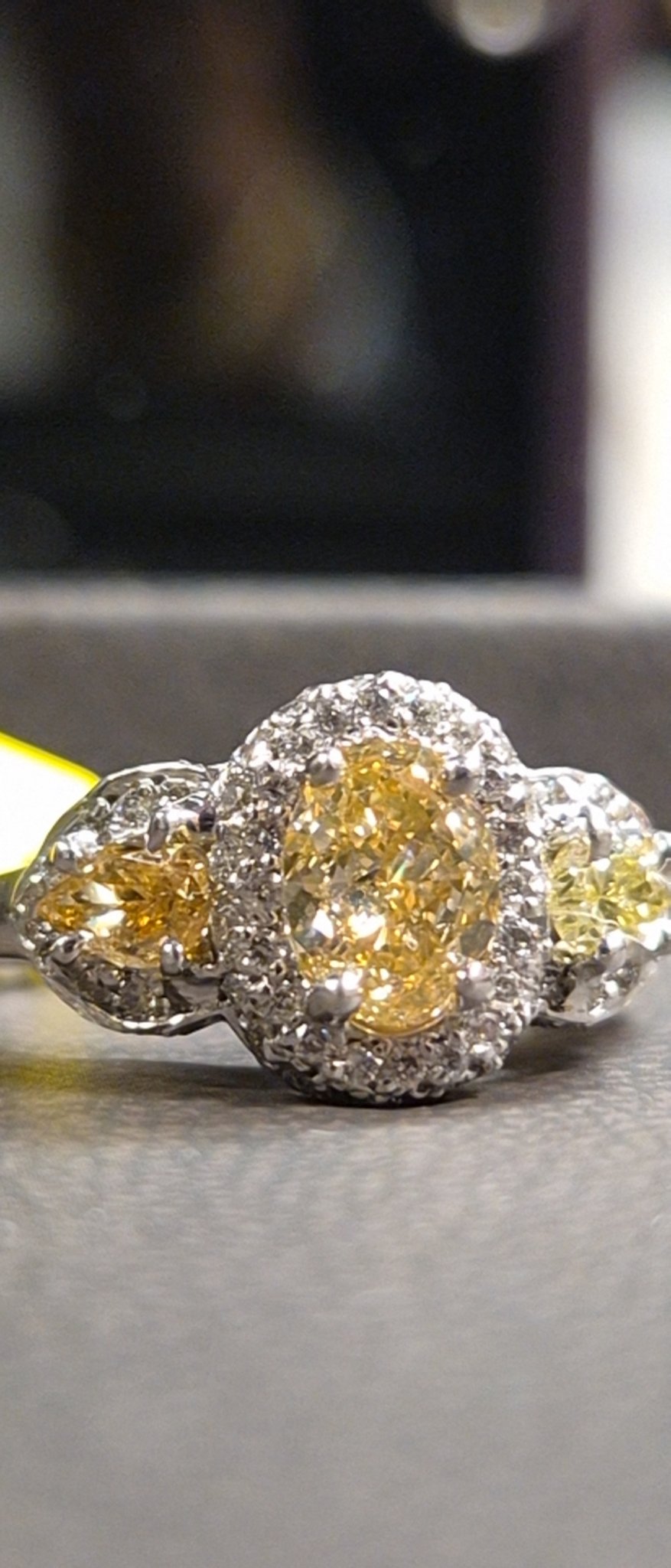 Yellow Diamond Three-Stone Halo Ring