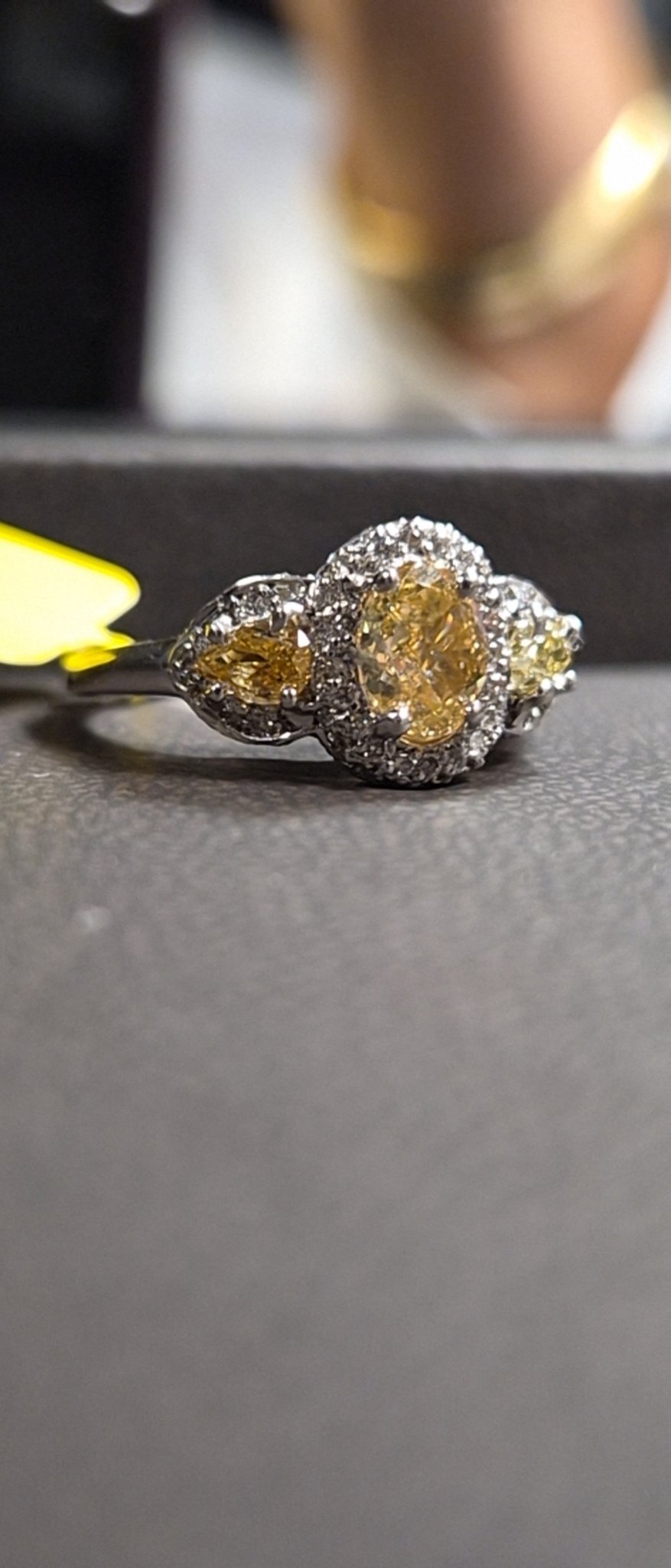 Yellow Diamond Three-Stone Halo Ring